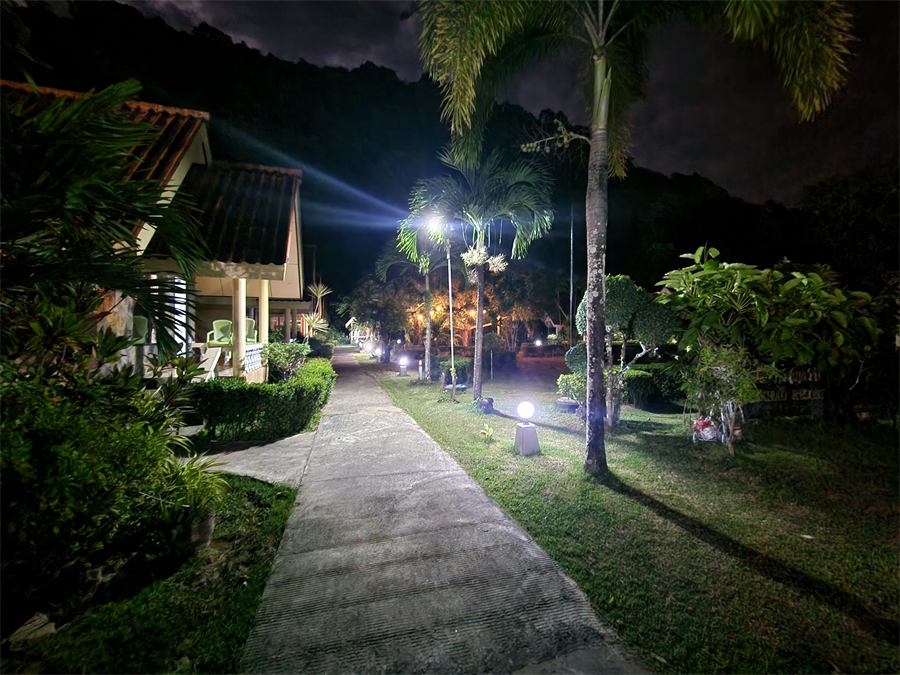 The garden path lit up at night