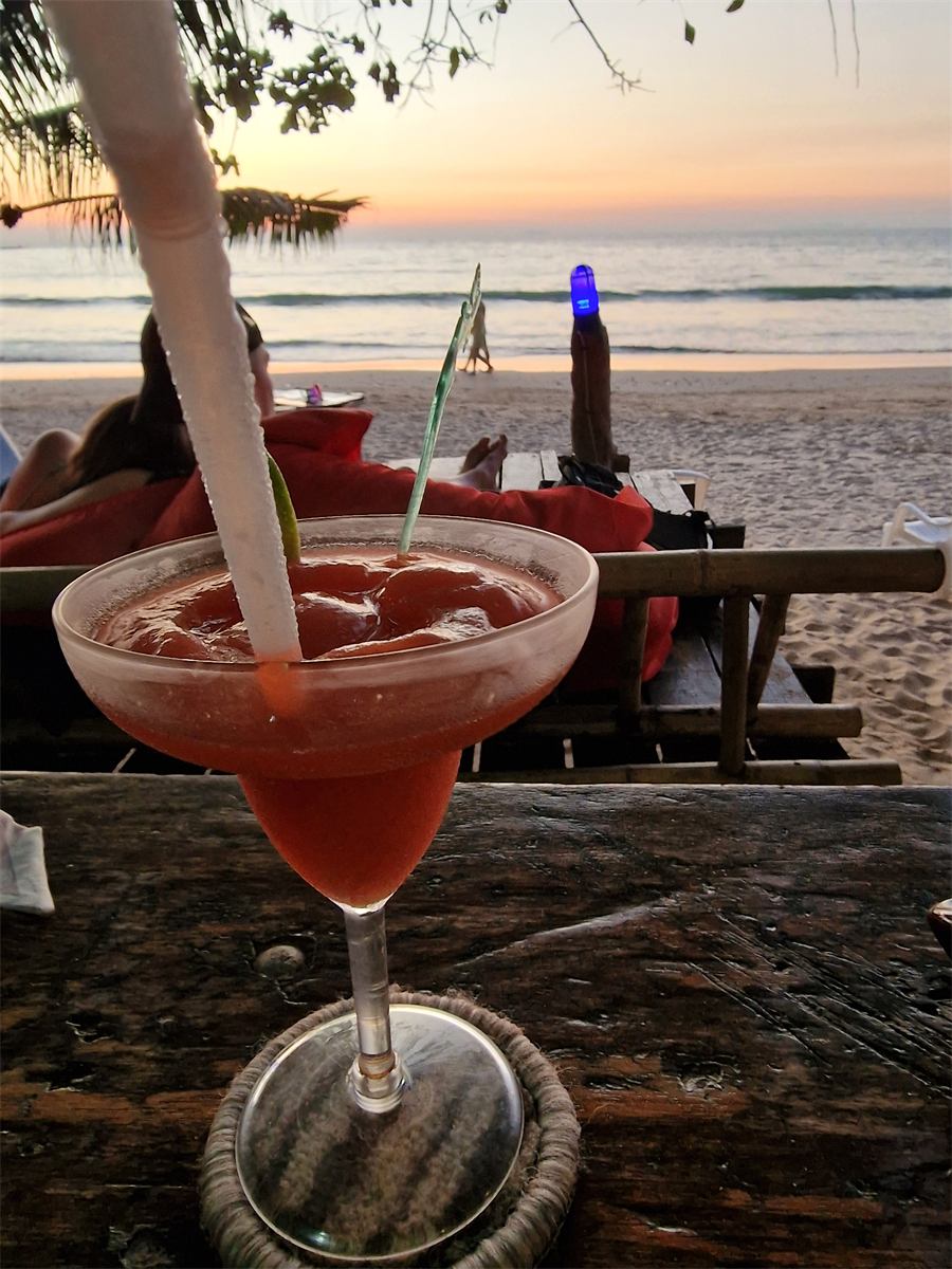 A cocktail at the beach bar at sunset